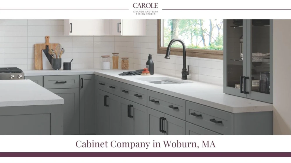 Modern gray and white kitchen cabinets with sleek black handles in Woburn, MA
